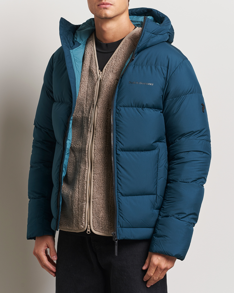 Heren |  | Peak Performance | Rivel Down Hooded Jacket Ininity Teel